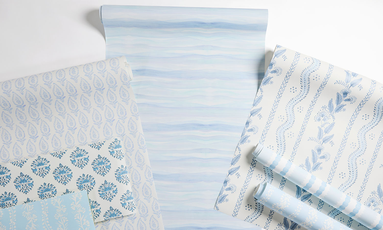 A laydown of blue inspired wallpaper.