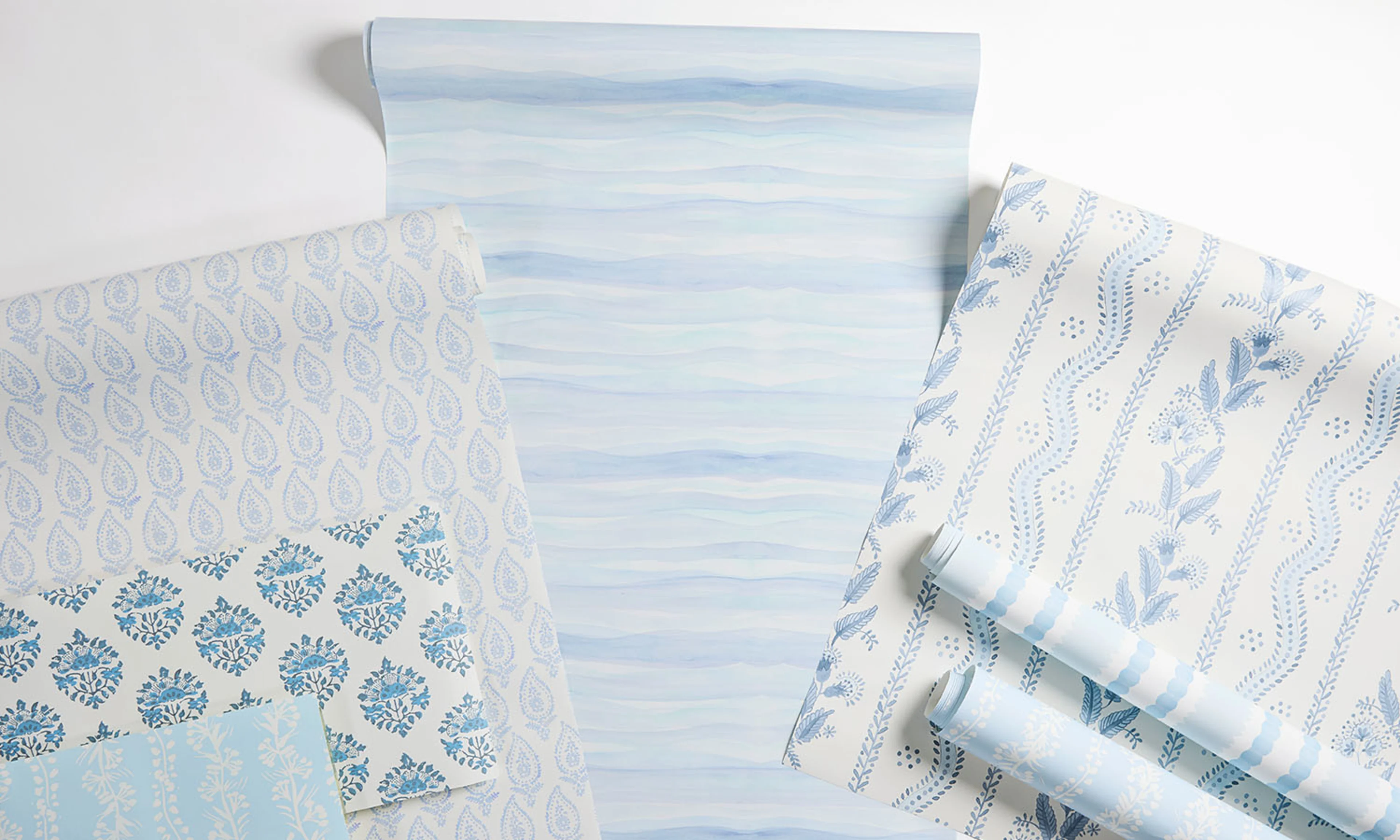 A laydown of blue inspired wallpaper.