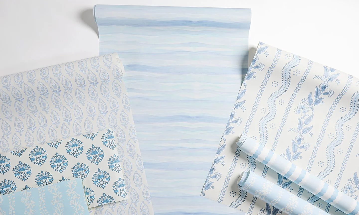 A laydown of blue inspired wallpaper.