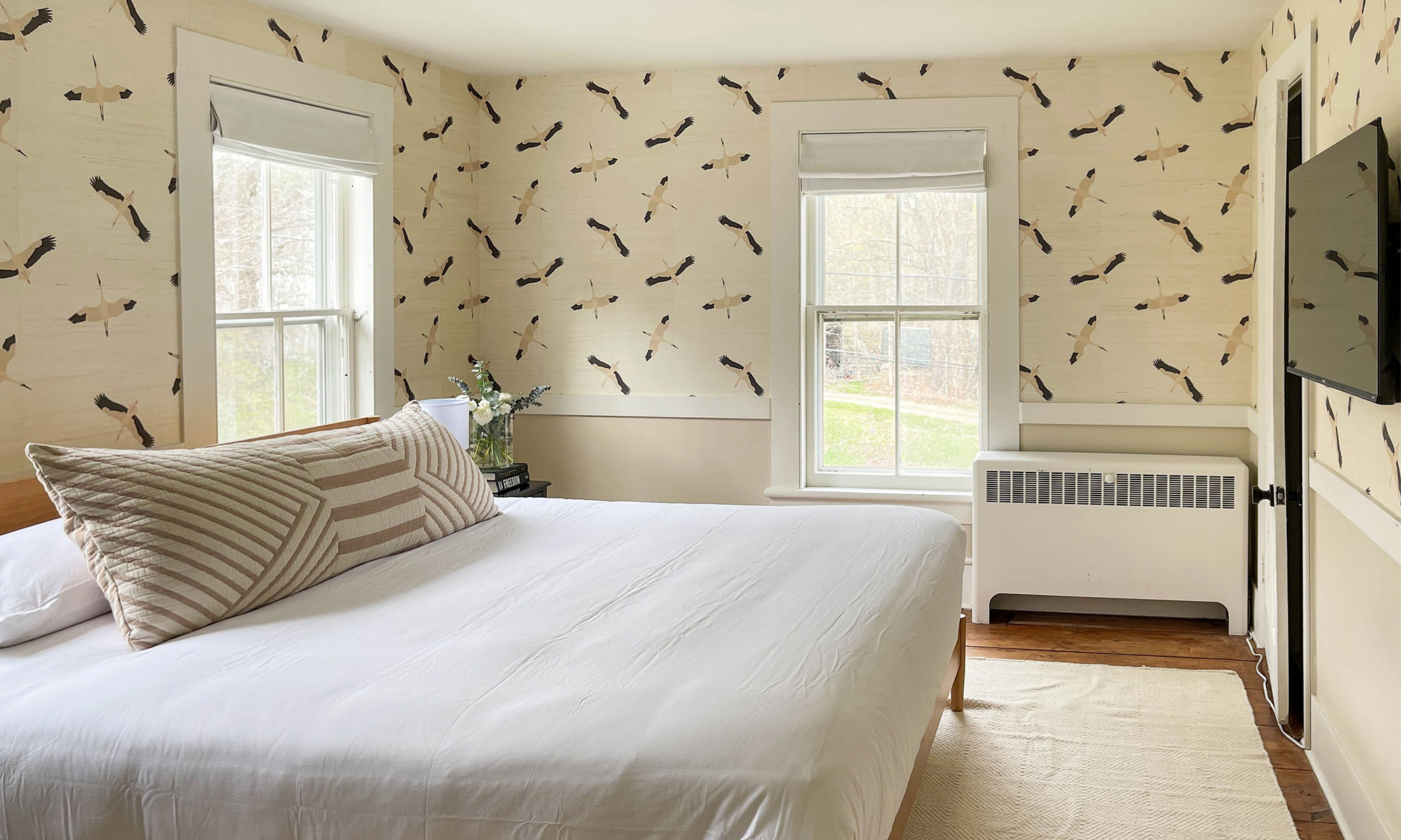 Bedroom with crane grasscloth wallpaper.