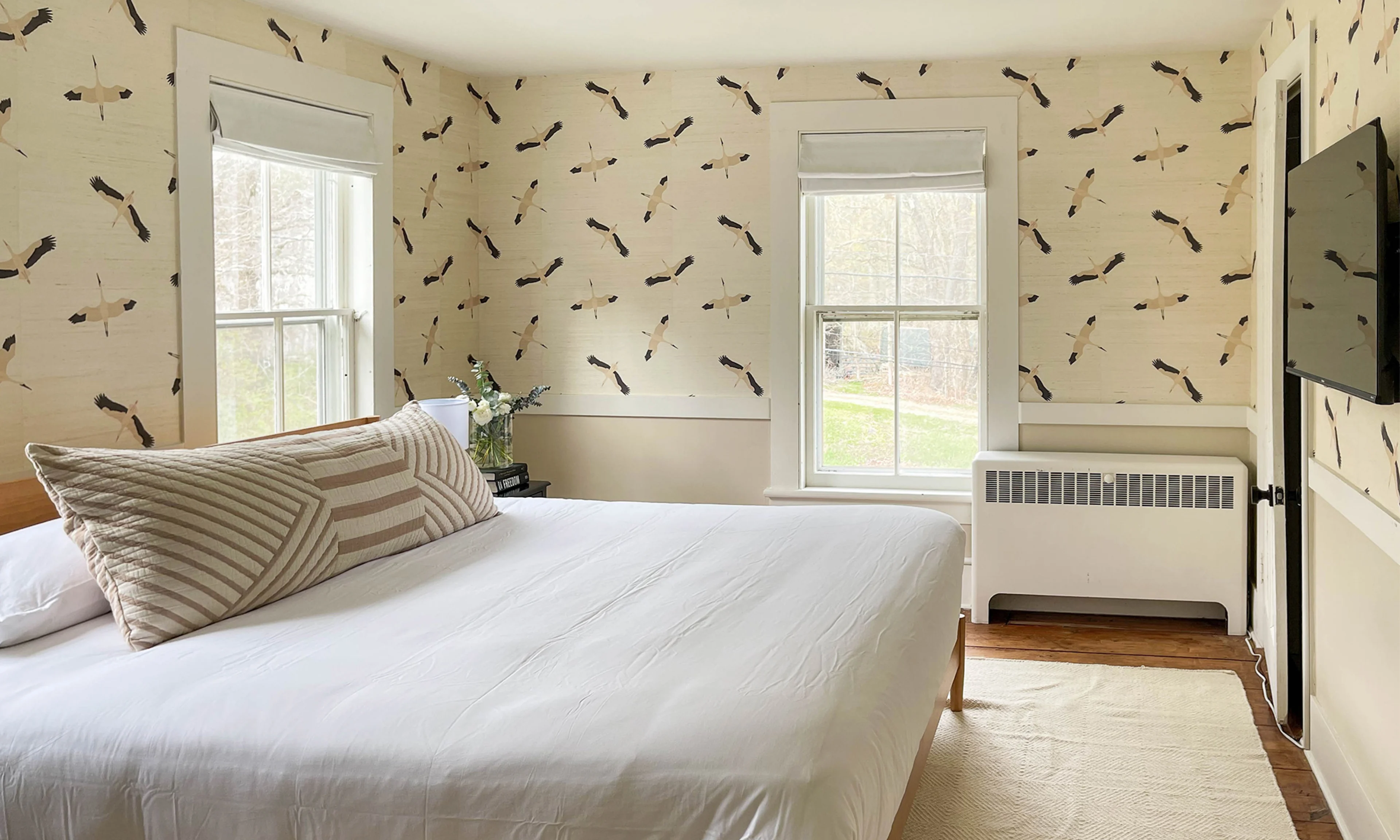 Bedroom with crane grasscloth wallpaper.