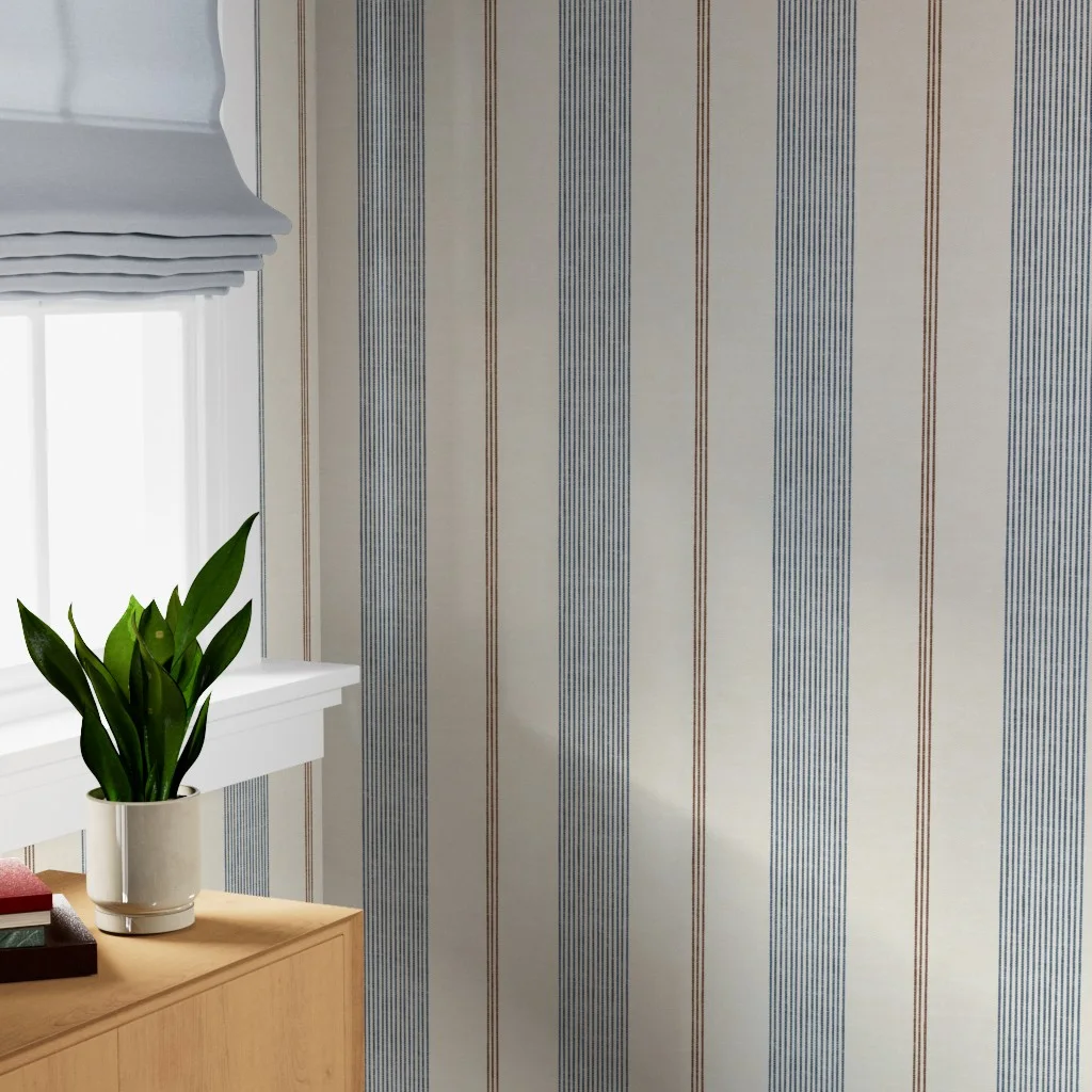 Blue and cream ticking stripe wallpaper in a living space.