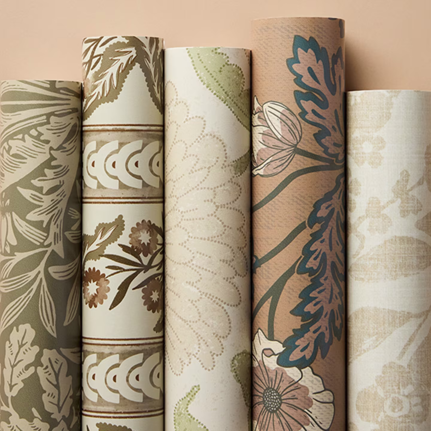 Rolls of earthy beige wallpapers.