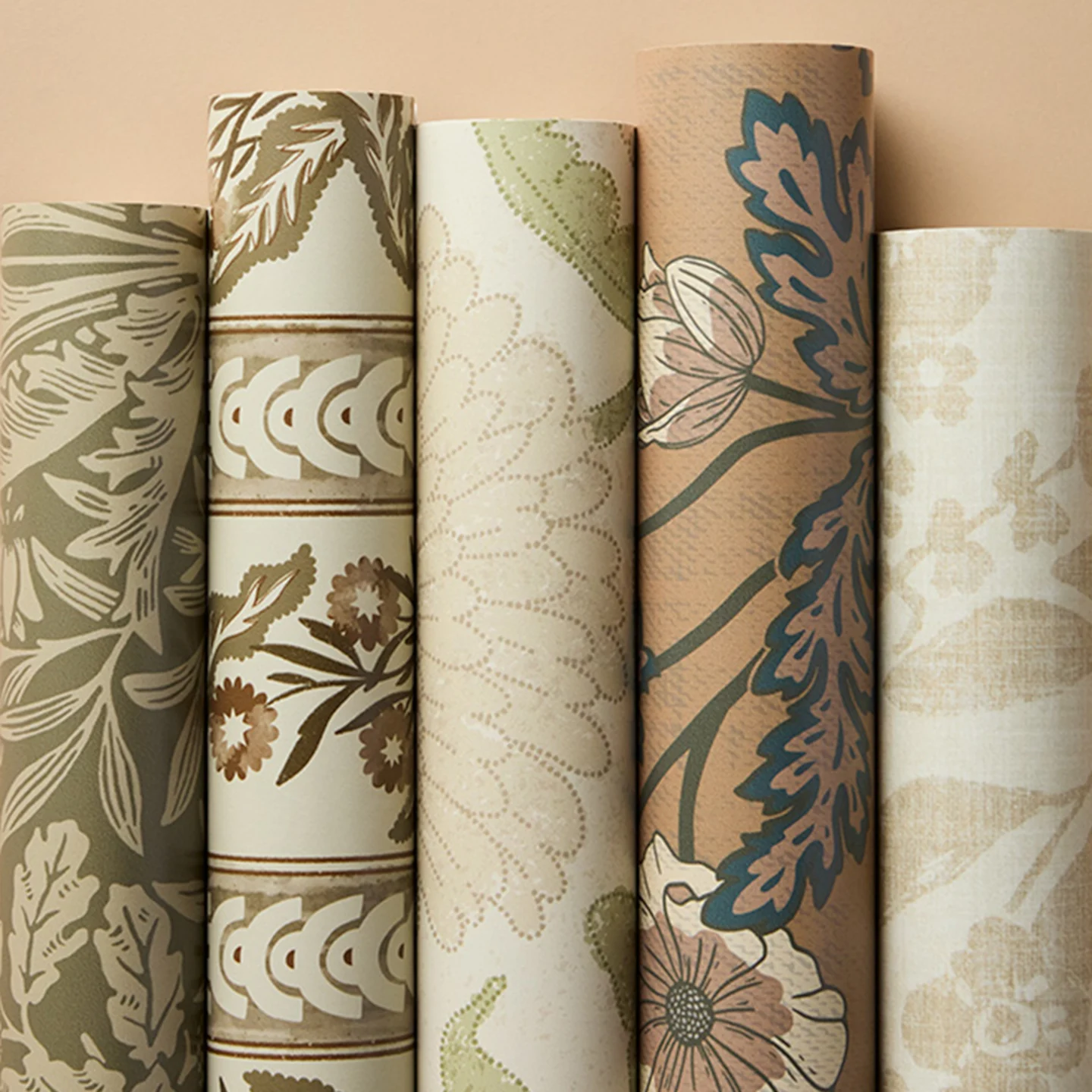 Rolls of earthy beige wallpapers.
