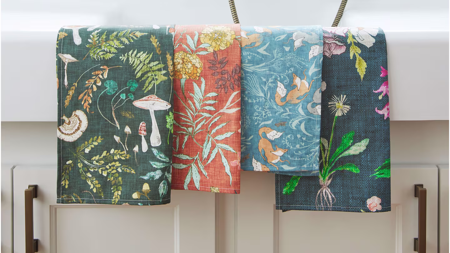 Four kitchen wash cloths with mushrooms, foxes and plant designs.