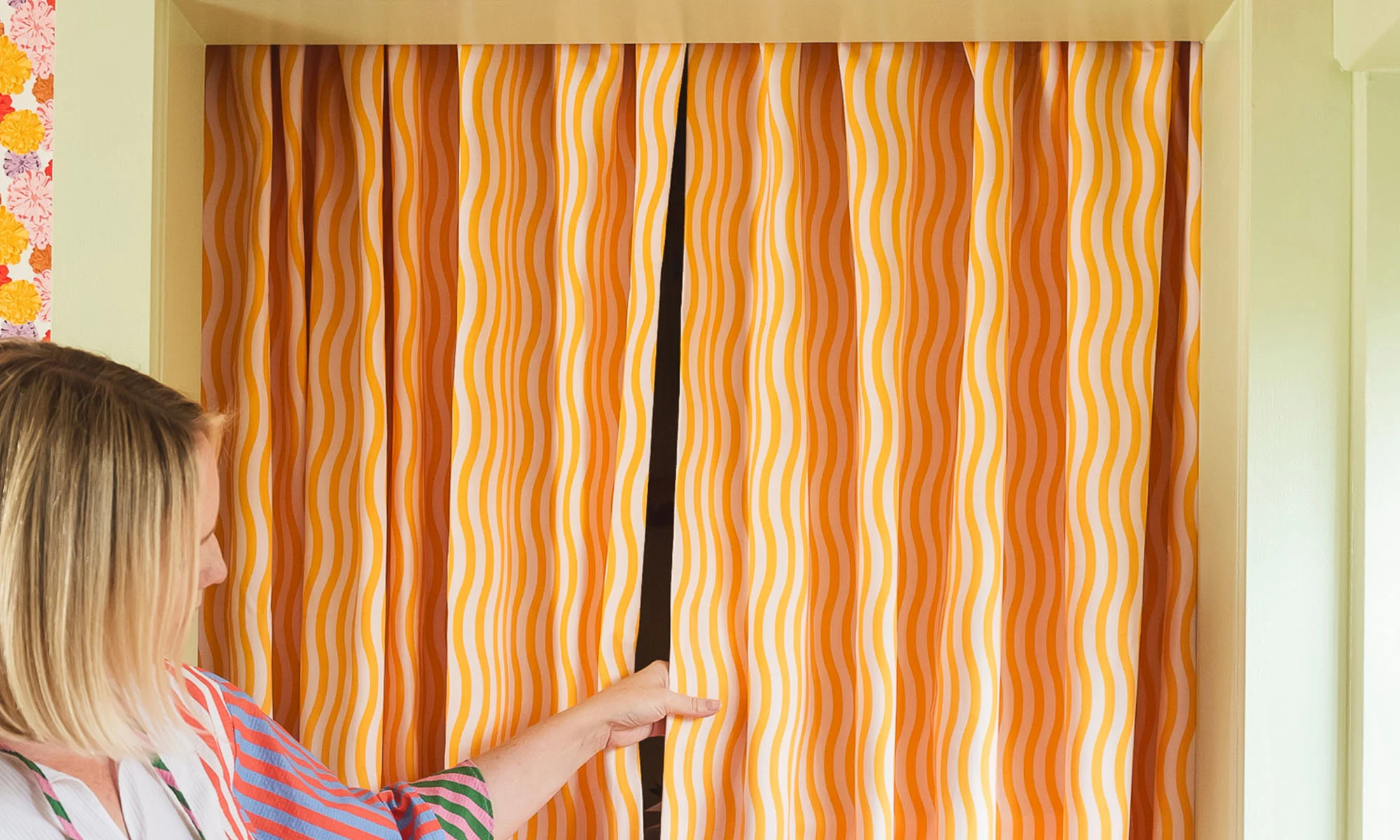 Brittany holding her curtains.