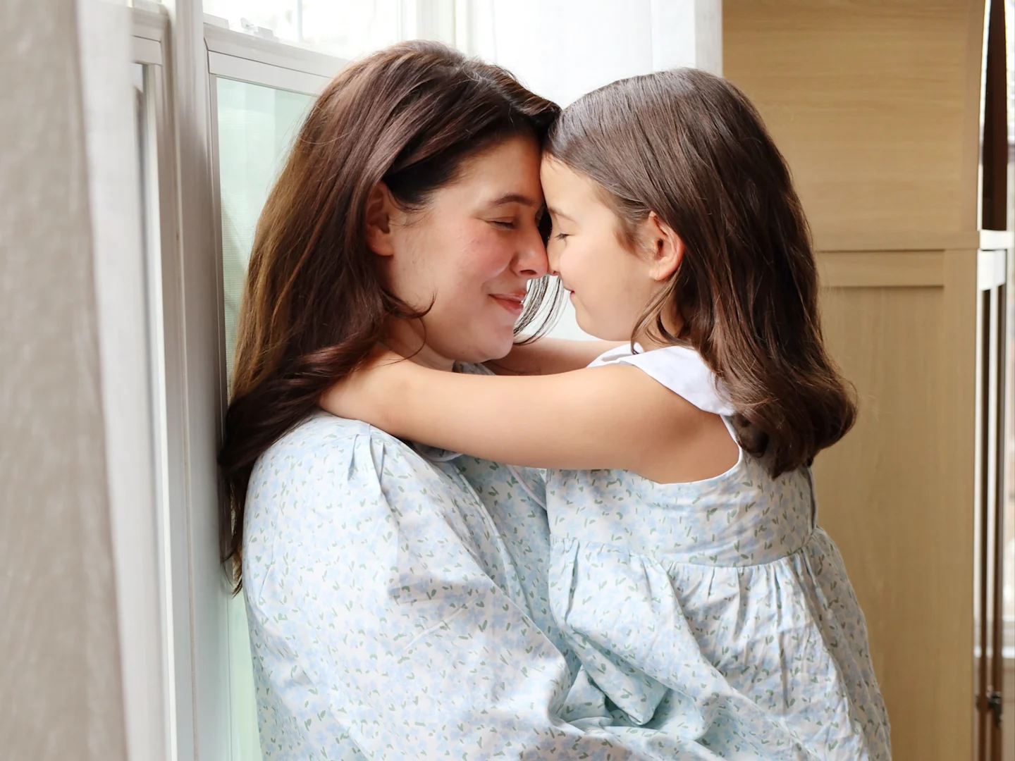 Gabriela Fasola and her daughter in matching floral pajamas made with Spoonflower Organic Cotton Sateen