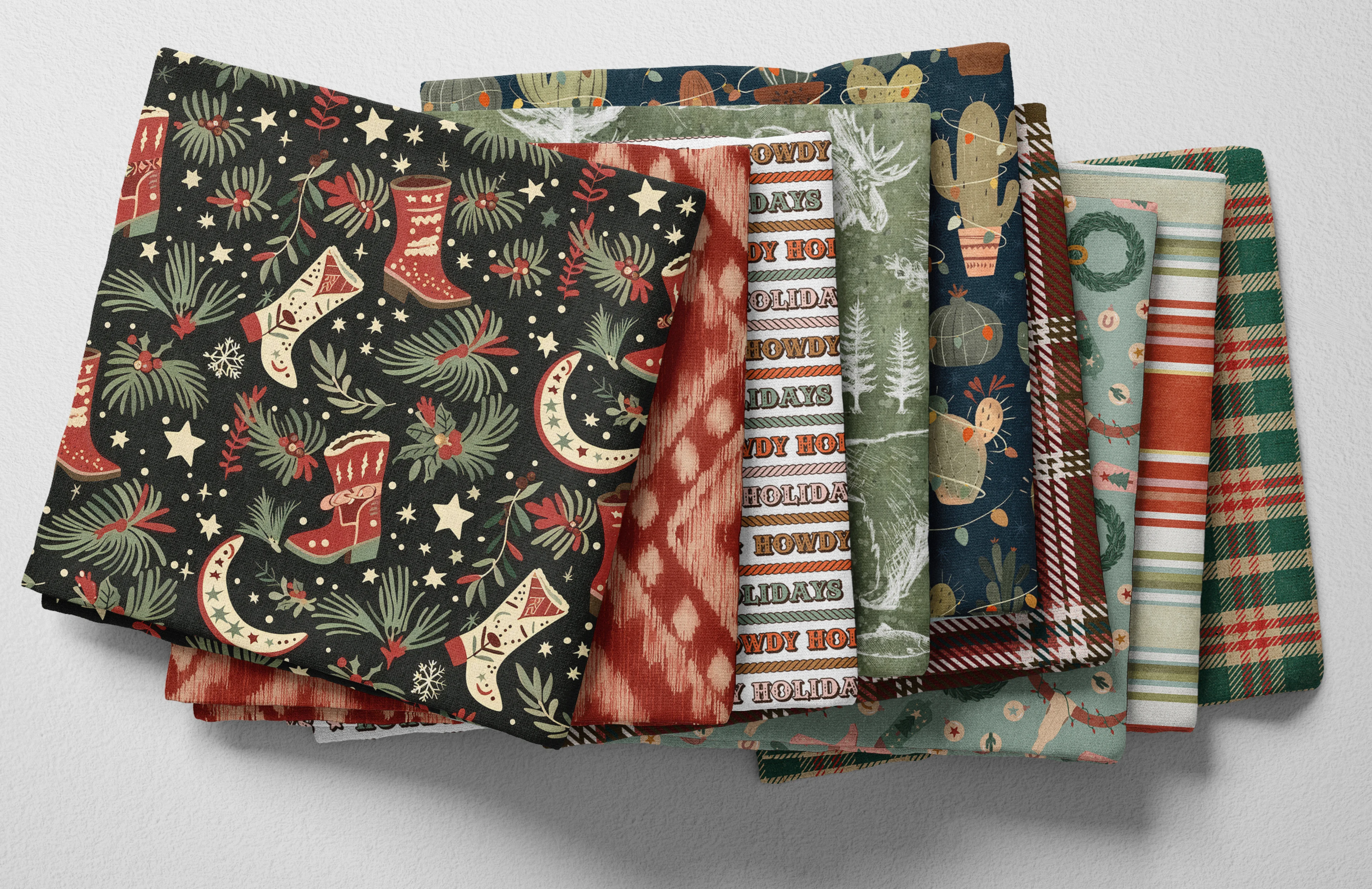 Colorful folded Spoonflower fabric with a whimsical western winter theme