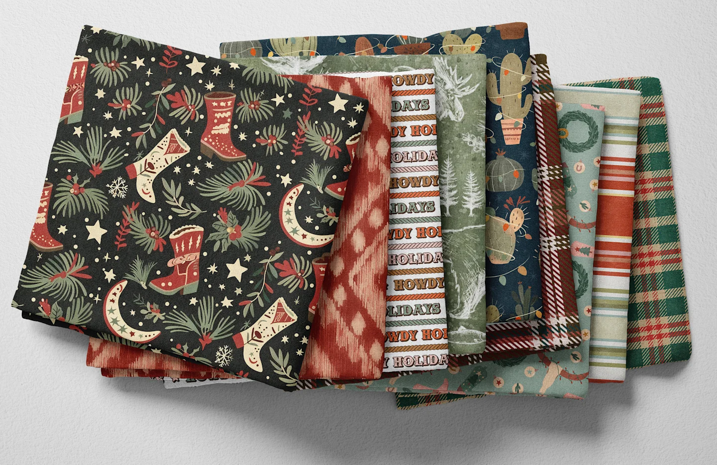 Colorful folded Spoonflower fabric with a whimsical western winter theme