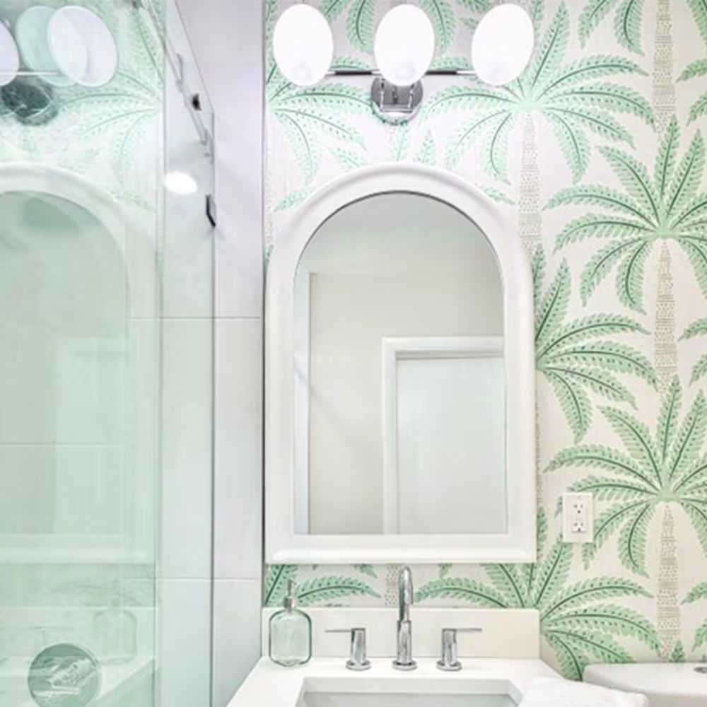 Bathroom with wallpaper in Tropical Palm Tree Motif with Dotted Trunks by eliveradesigns.