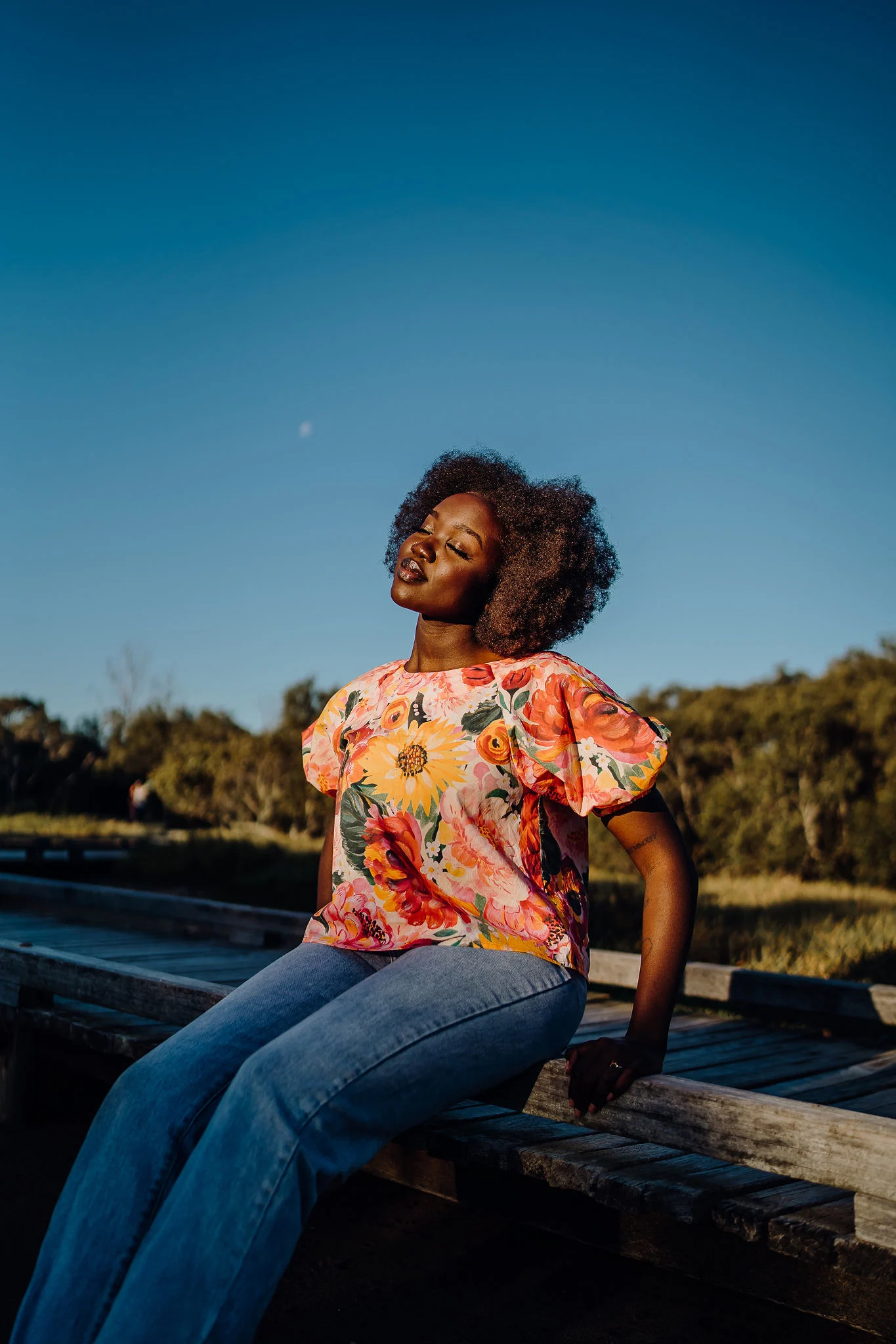 A model in a pink floral top made with Cotton Lawn