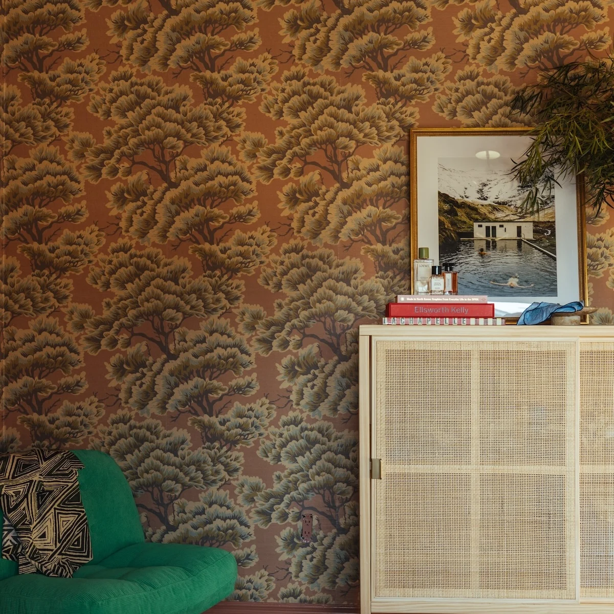 grasscloth wallpaper with a green chair and beige dresser