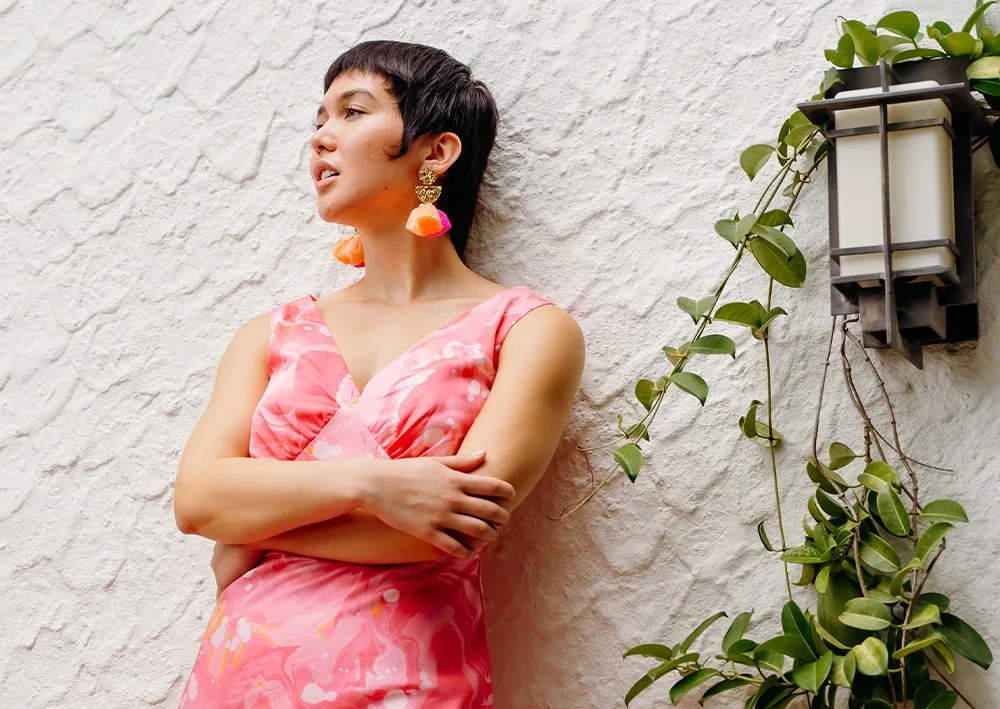 A model in a pink dress made with Cotton Silk