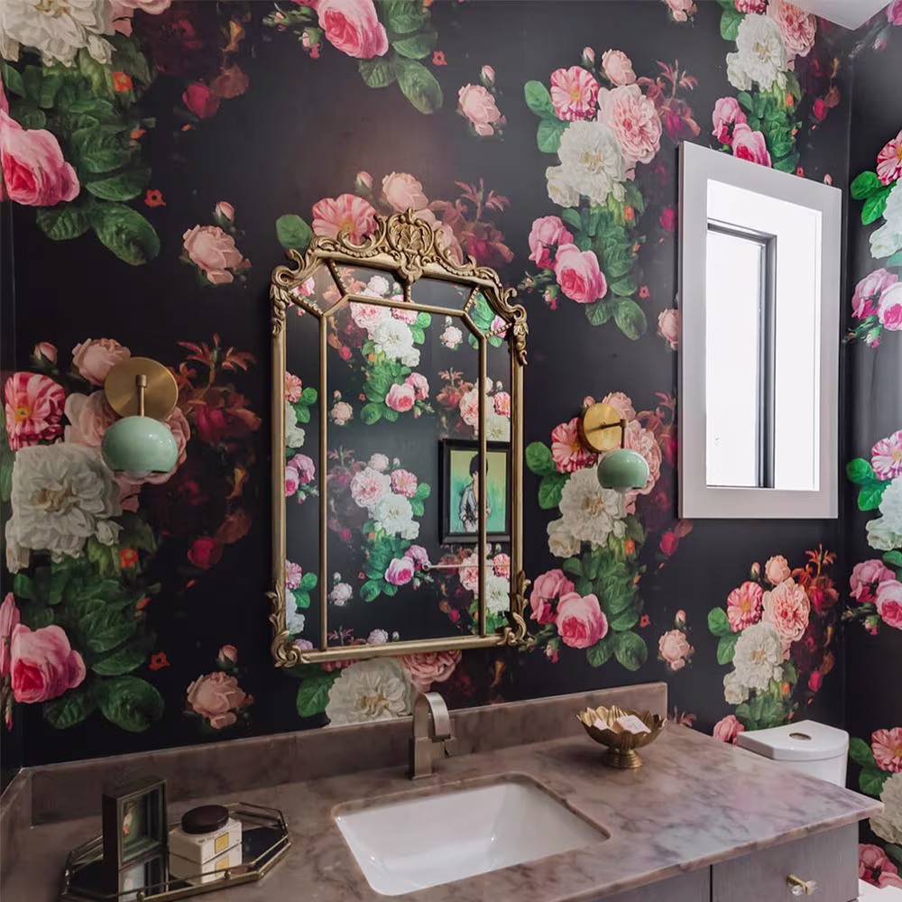 Moody floral wallpaper in a bathroom.