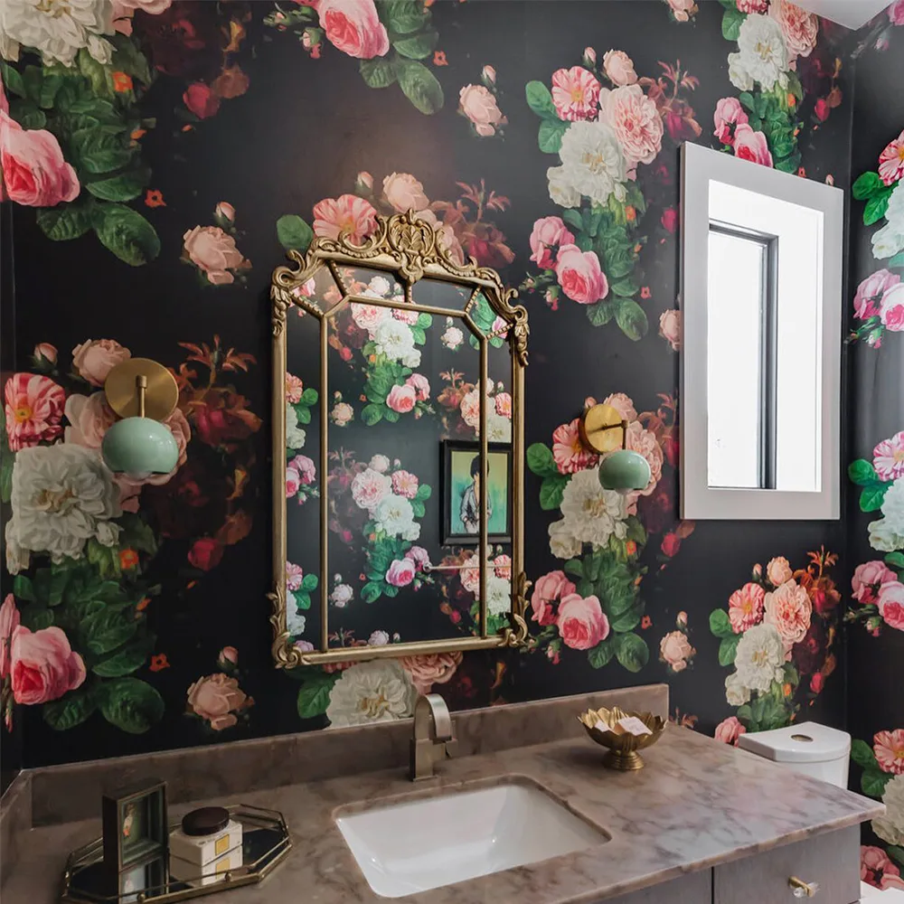 Moody floral wallpaper in a bathroom.
