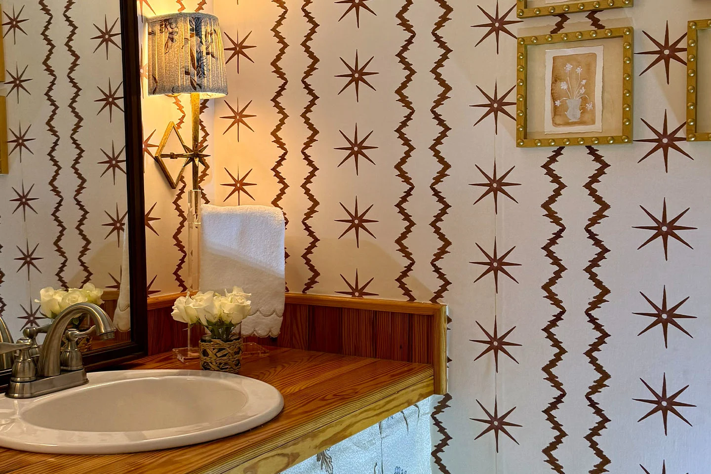 Powder room with Spoonflower wallpaper and DIY Spoonflower fabric sink skirt.