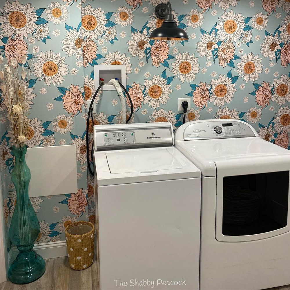 Laundry room with blue floral wallpaper