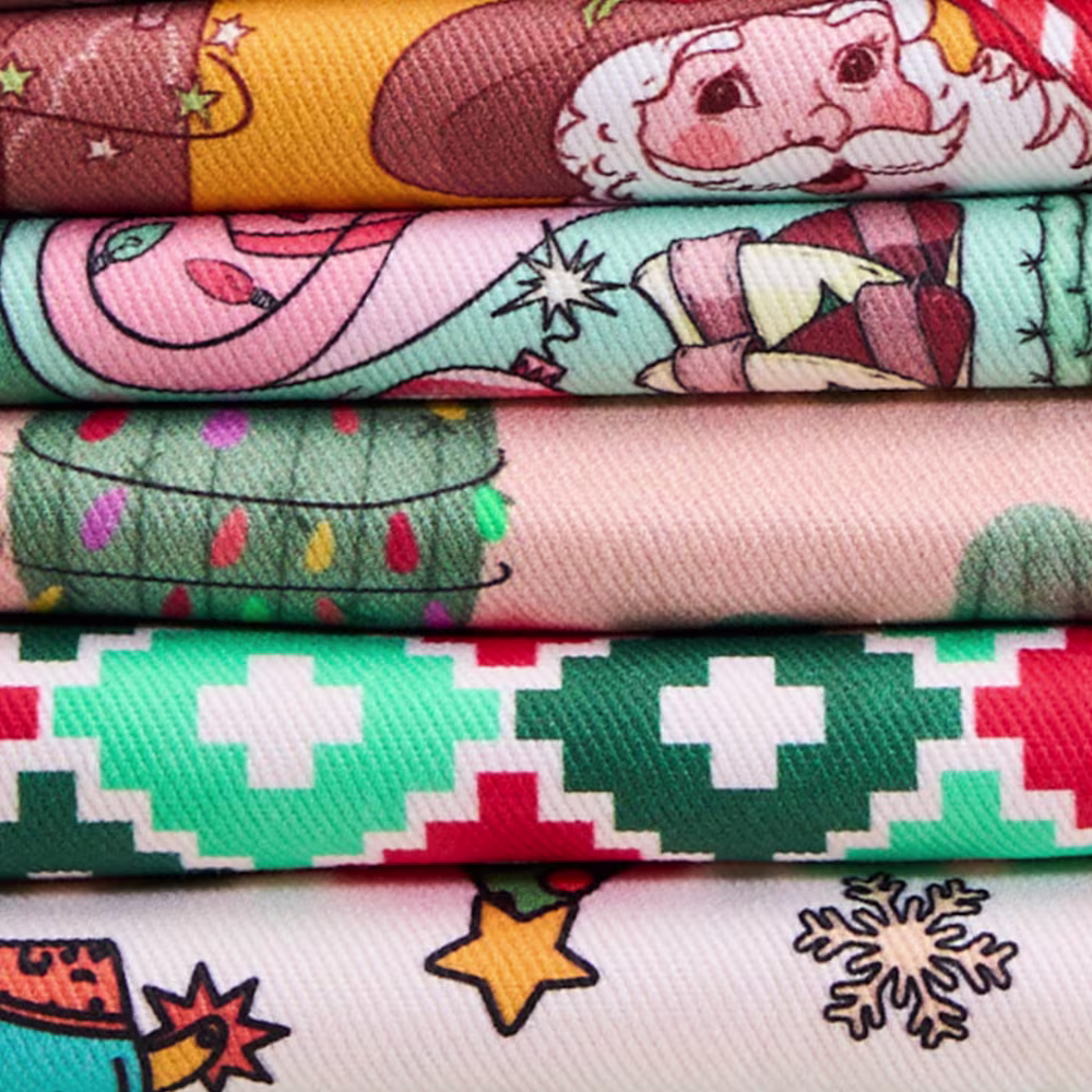 Stack of western cowboy christmas themed fabrics