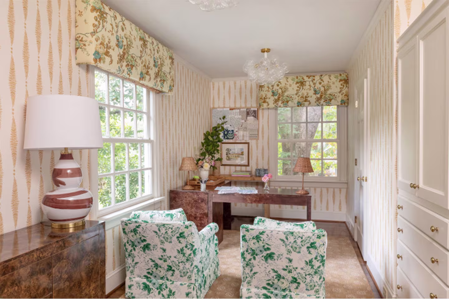 Office with pink scheme, with Spoonflower wallpaper and fabric upholstered chairs, and cafe curtains.