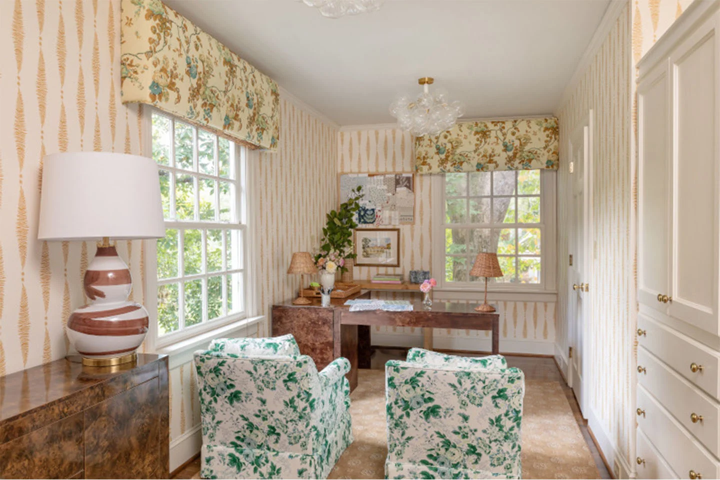 Office with pink scheme, with Spoonflower wallpaper and fabric upholstered chairs, and cafe curtains.