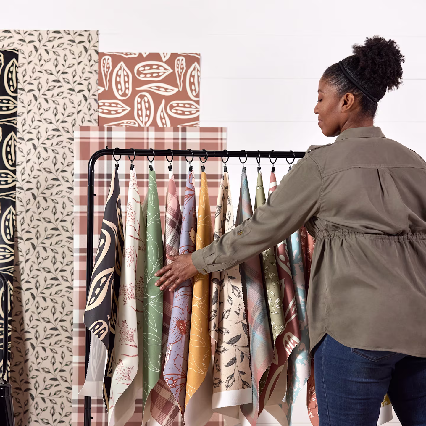 Annette Brown with a selection of her abstract and botanical designs on fabric and wallpaper