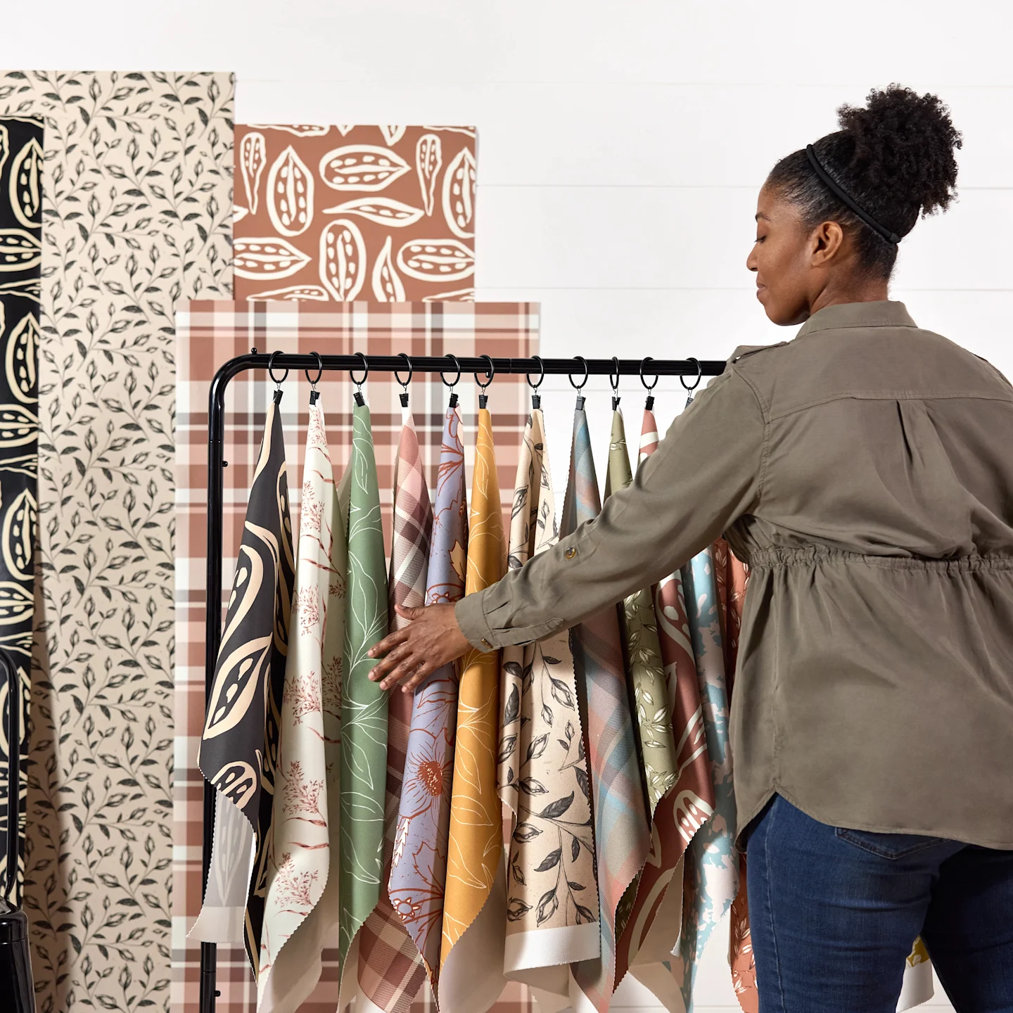 Annette Brown with a selection of her abstract and botanical designs on fabric and wallpaper