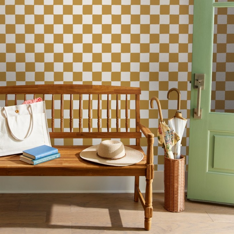 Rental kitchen with orange and white checker wallpaper.