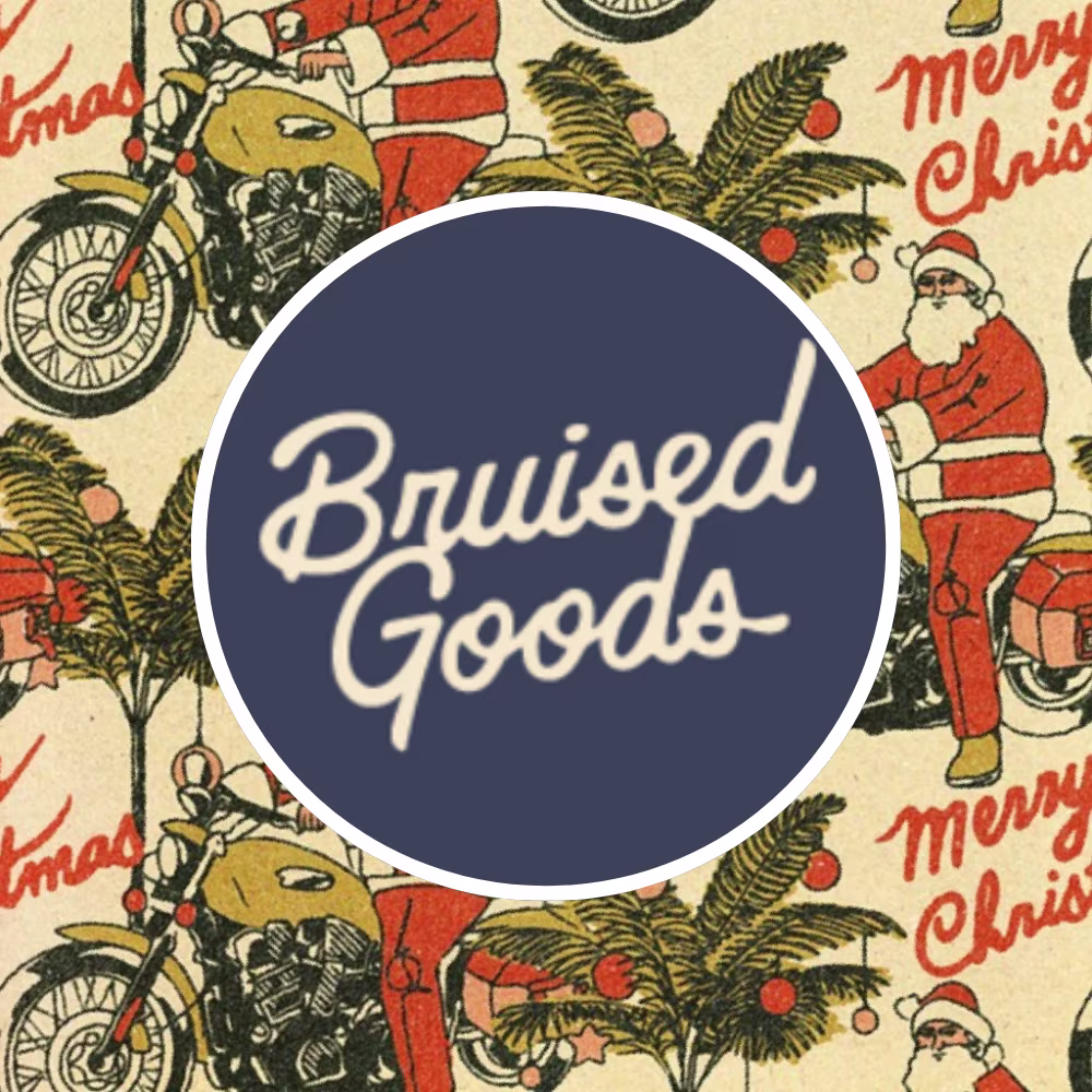 Santa on a motorcycle design by bruisedgoods with the designer logo.
