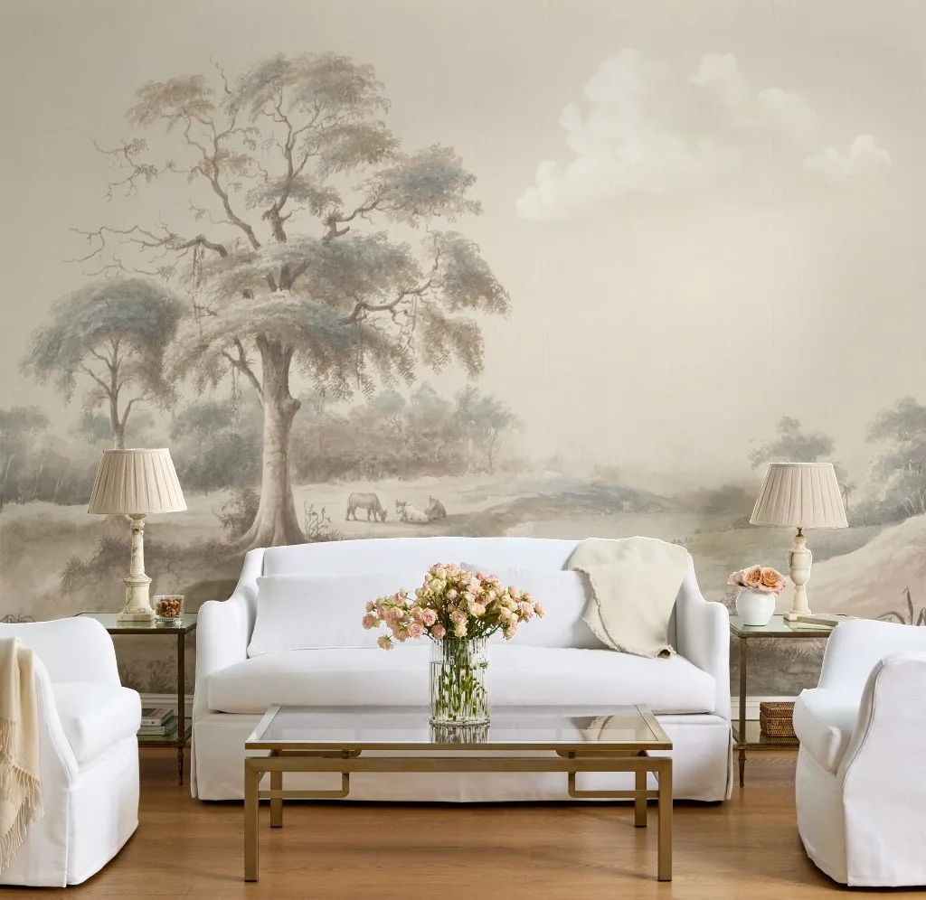 Living room featuring a panoramic landscape wall mural in soft neutral tones.