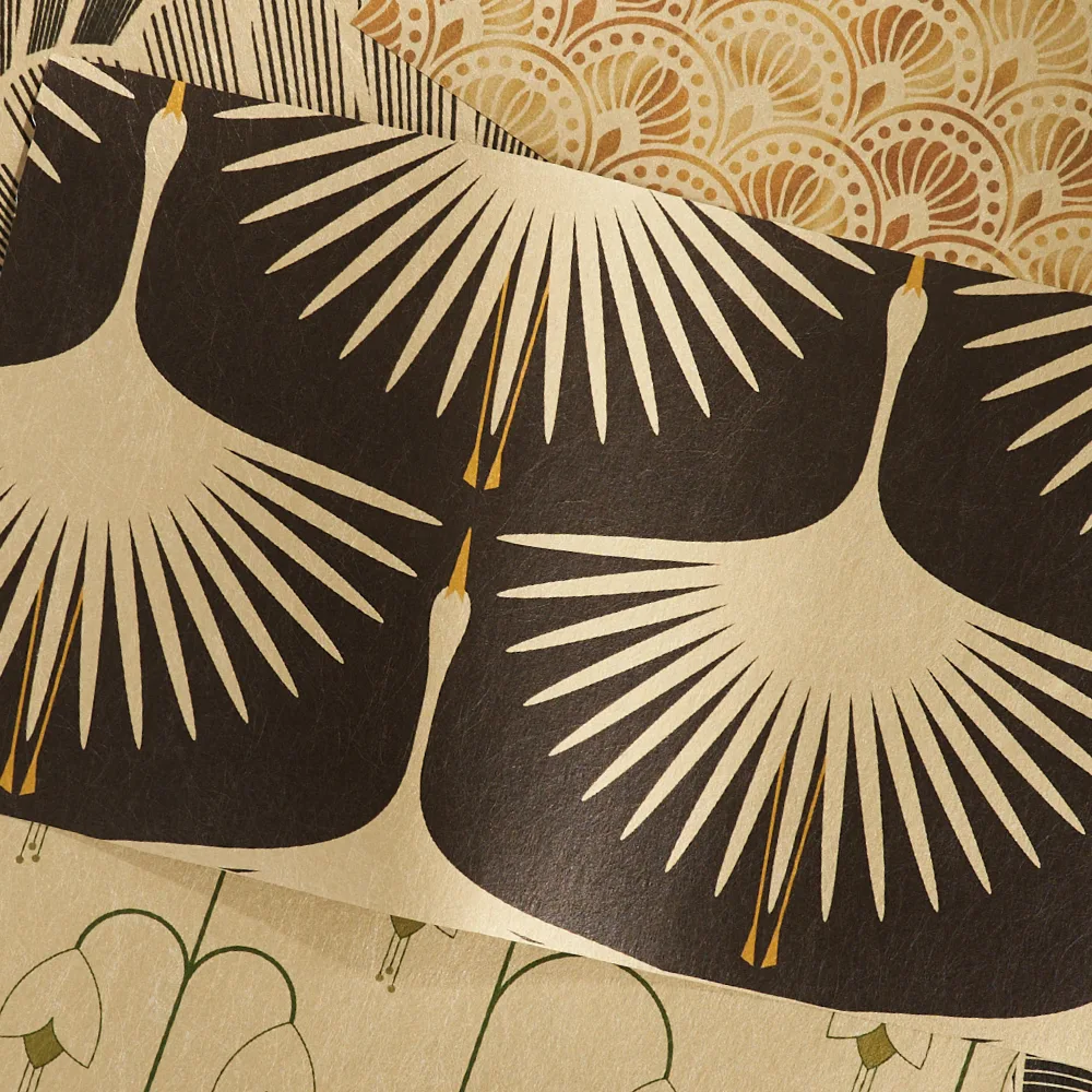 Art deco designs on gold metallic wallpaper