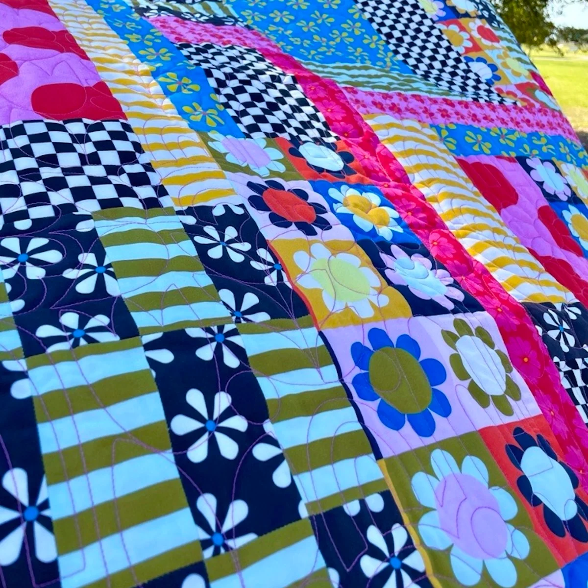 a close-up image of a colorful quilt.