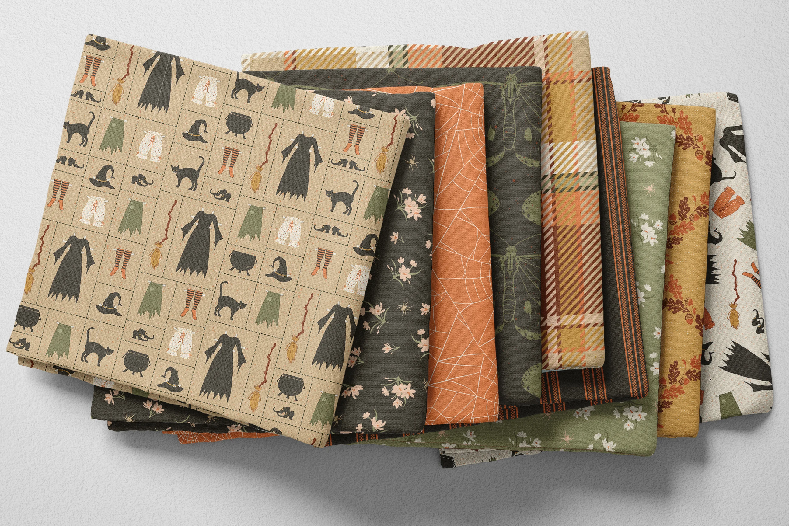 Colorful folded Spoonflower fabric with a spooky Halloween theme