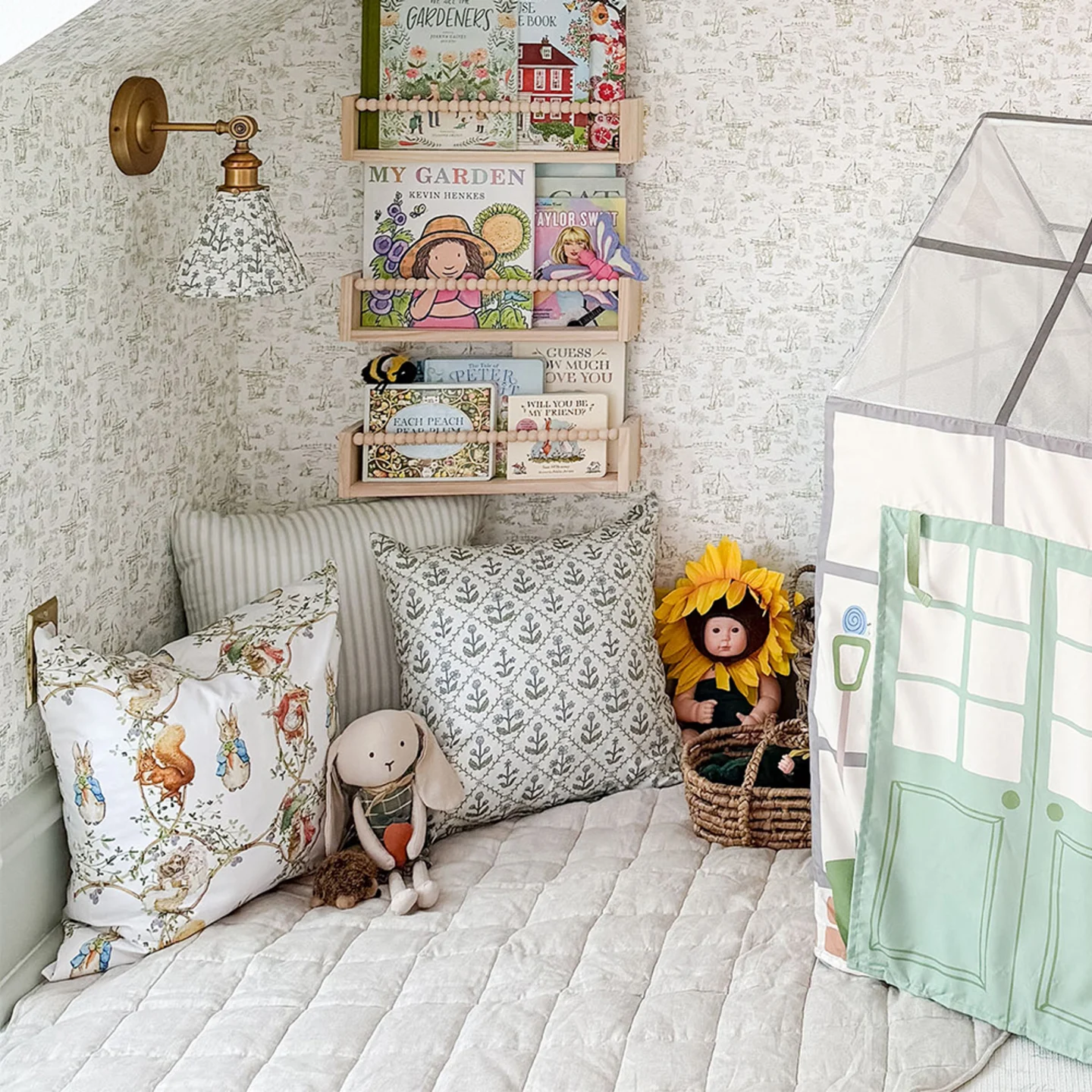 Kids playroom with a toile peel and stick wallpaper.