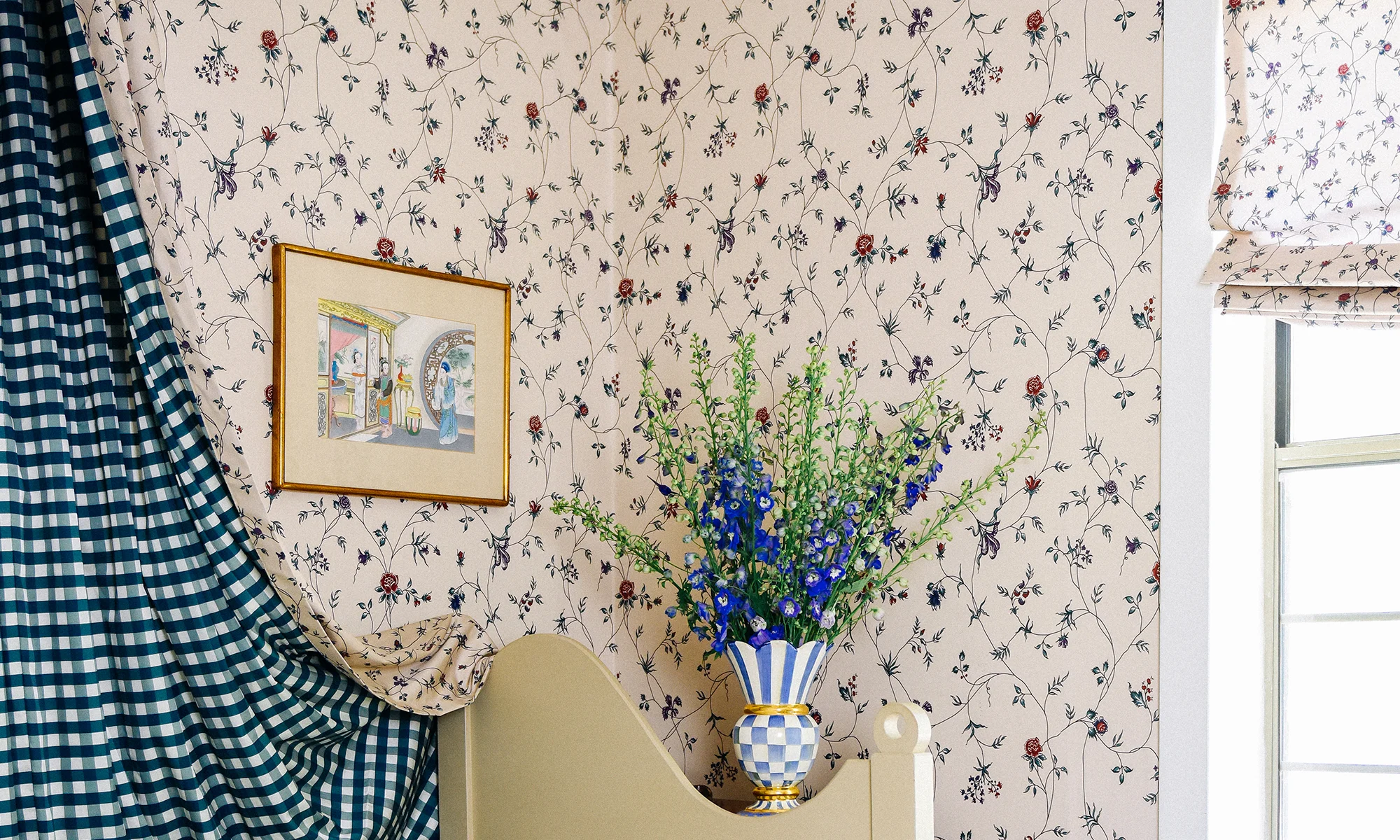 Guest bedroom with a floral chintz tan peel and stick wallpaper.