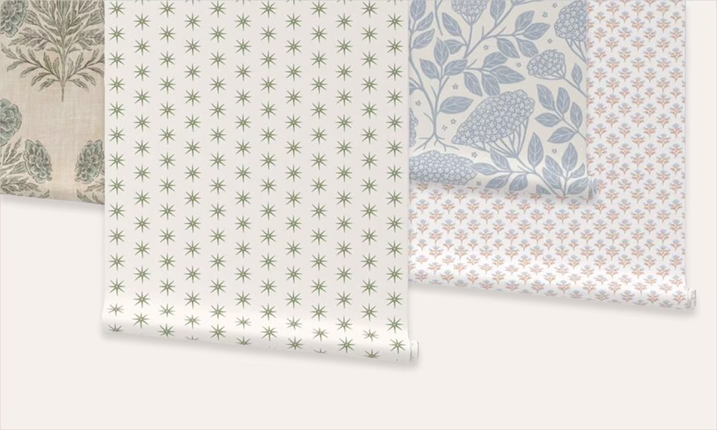 An assortment of pastel neutral wallpaper rolls