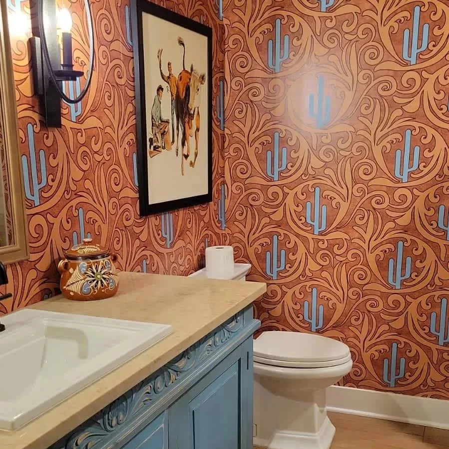 Bathroom with cactus wallpaper.