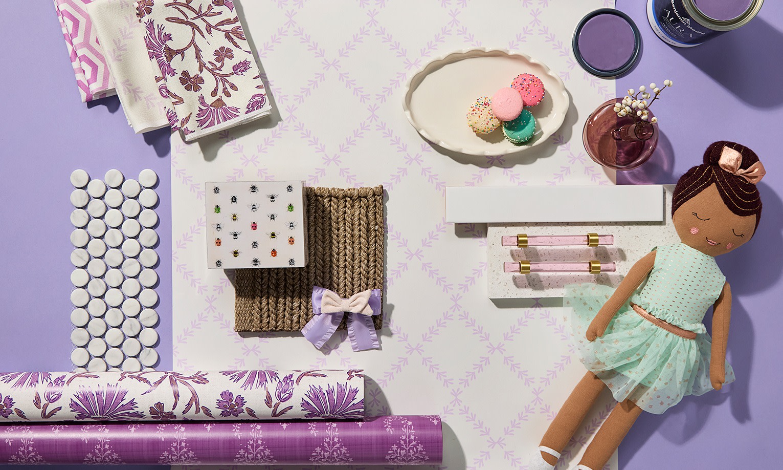 Rolls of purple wallpaper on a purple background.