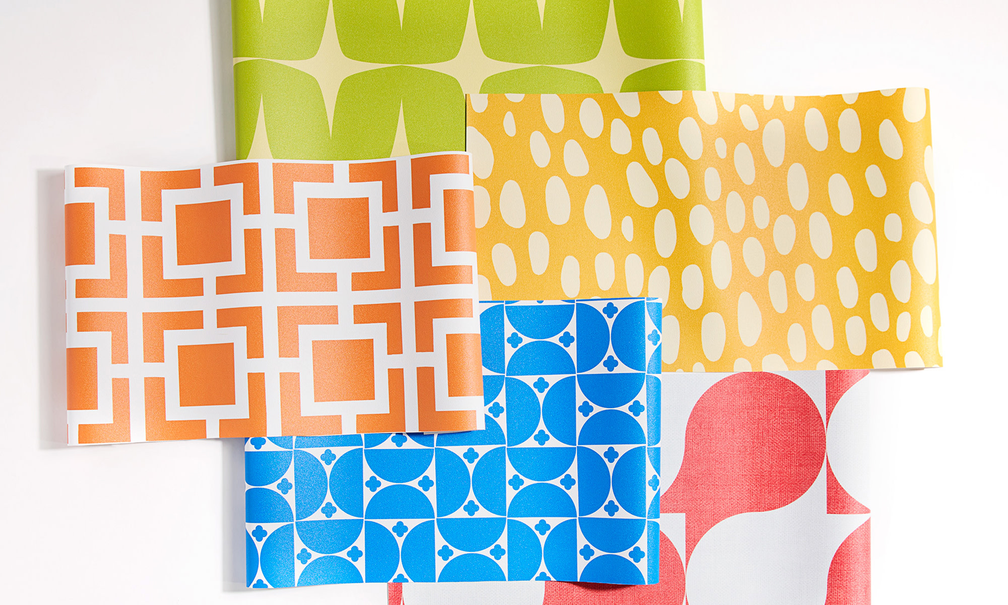 Swatches of colorful geometric vinyl wallpaper.