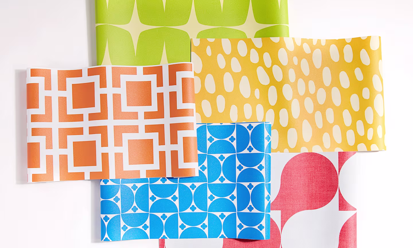 Swatches of colorful geometric vinyl wallpaper.