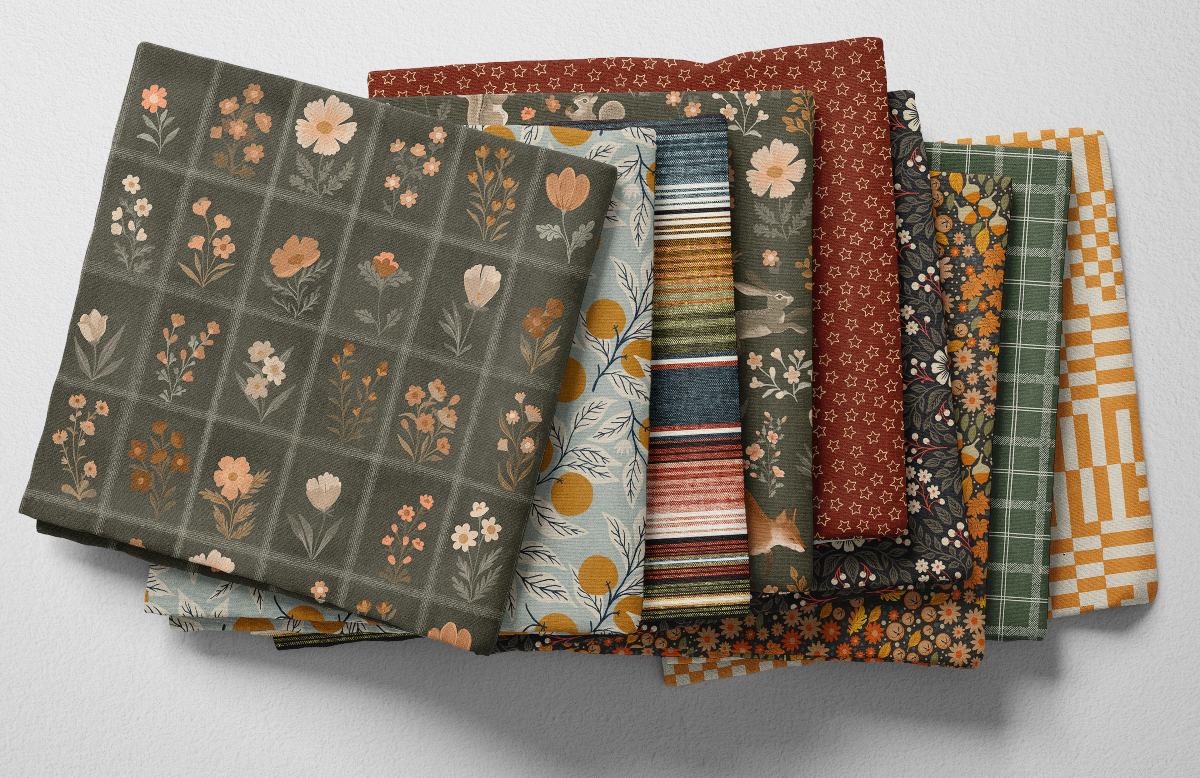 Autumn-themed folded Spoonflower fabric in earth tones