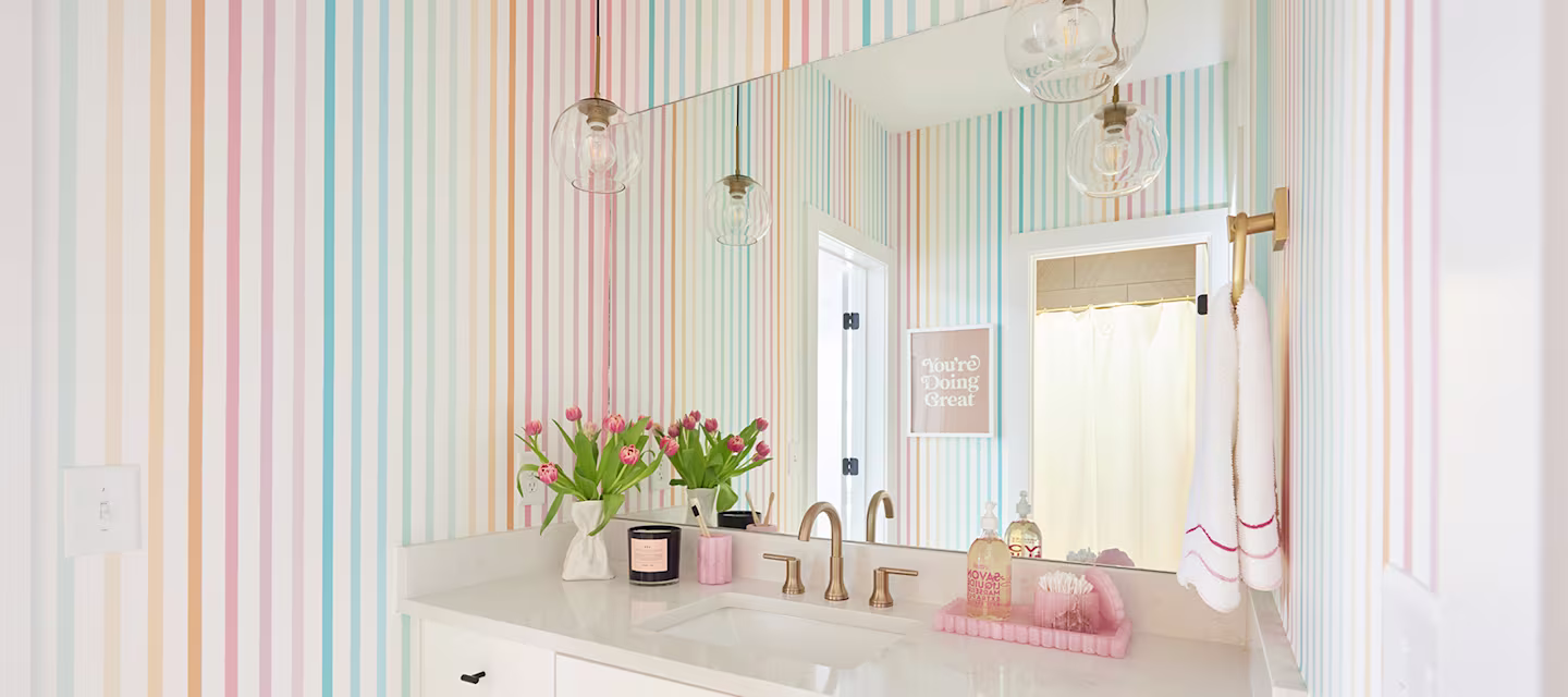 Rainbow striped wallpaper in a bathroom.