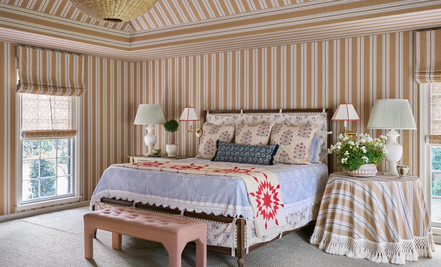 Bedroom covered in striped wallpaper on walls and ceiling.