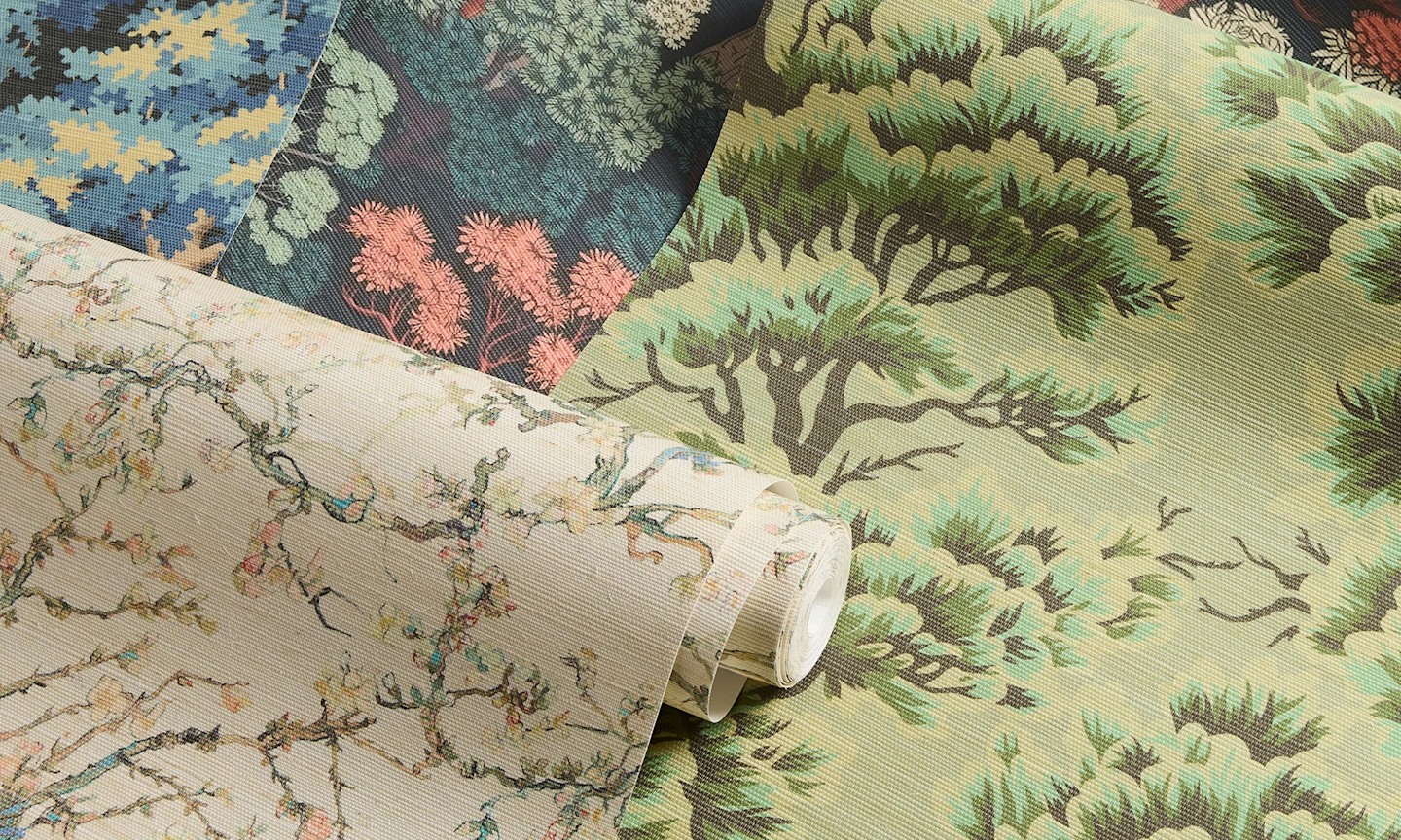 Rolls of grasscloth wallpaper with tree designs.