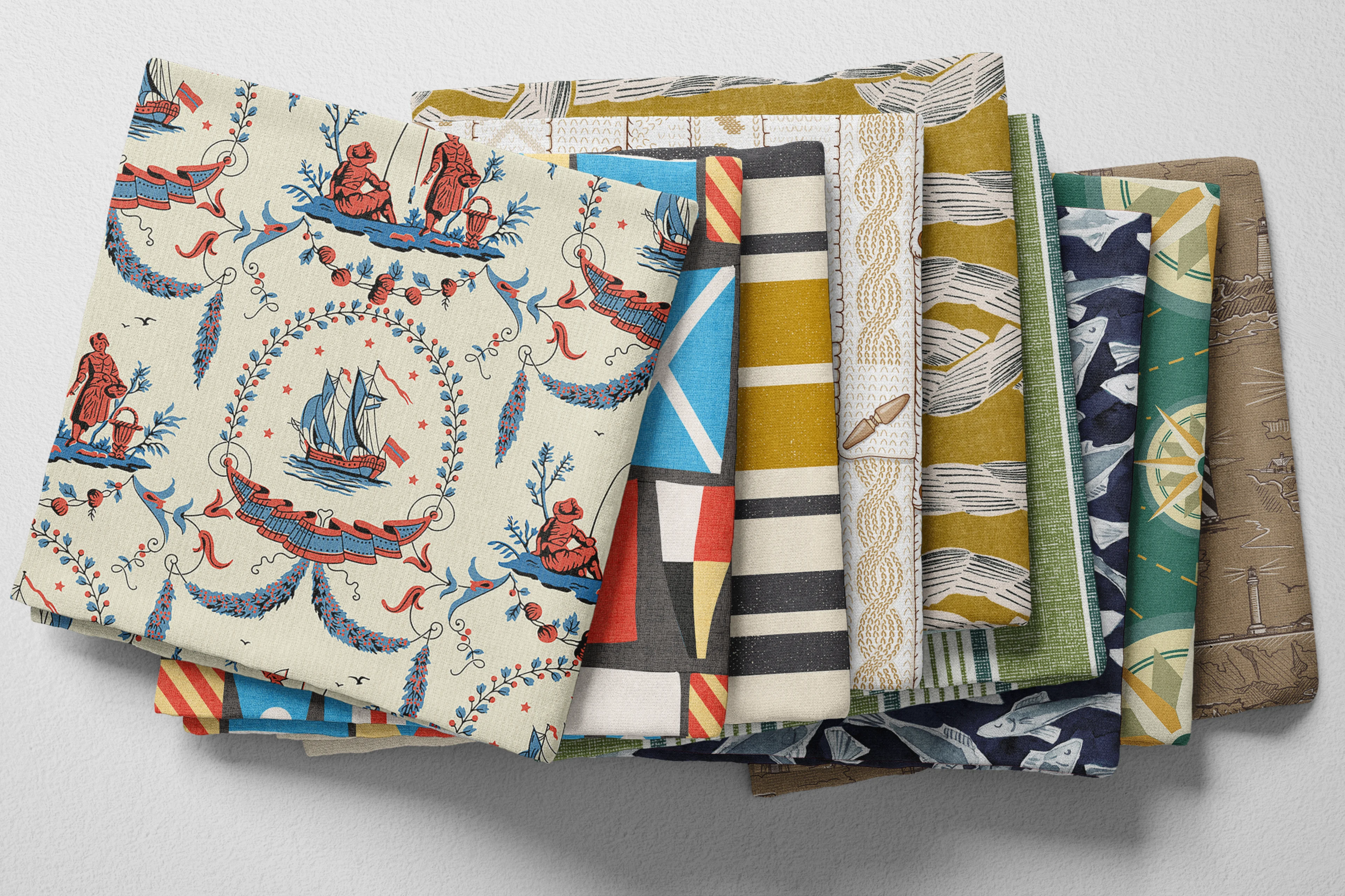 Colorful folded Spoonflower fabric with a vintage fisherman or fishing theme