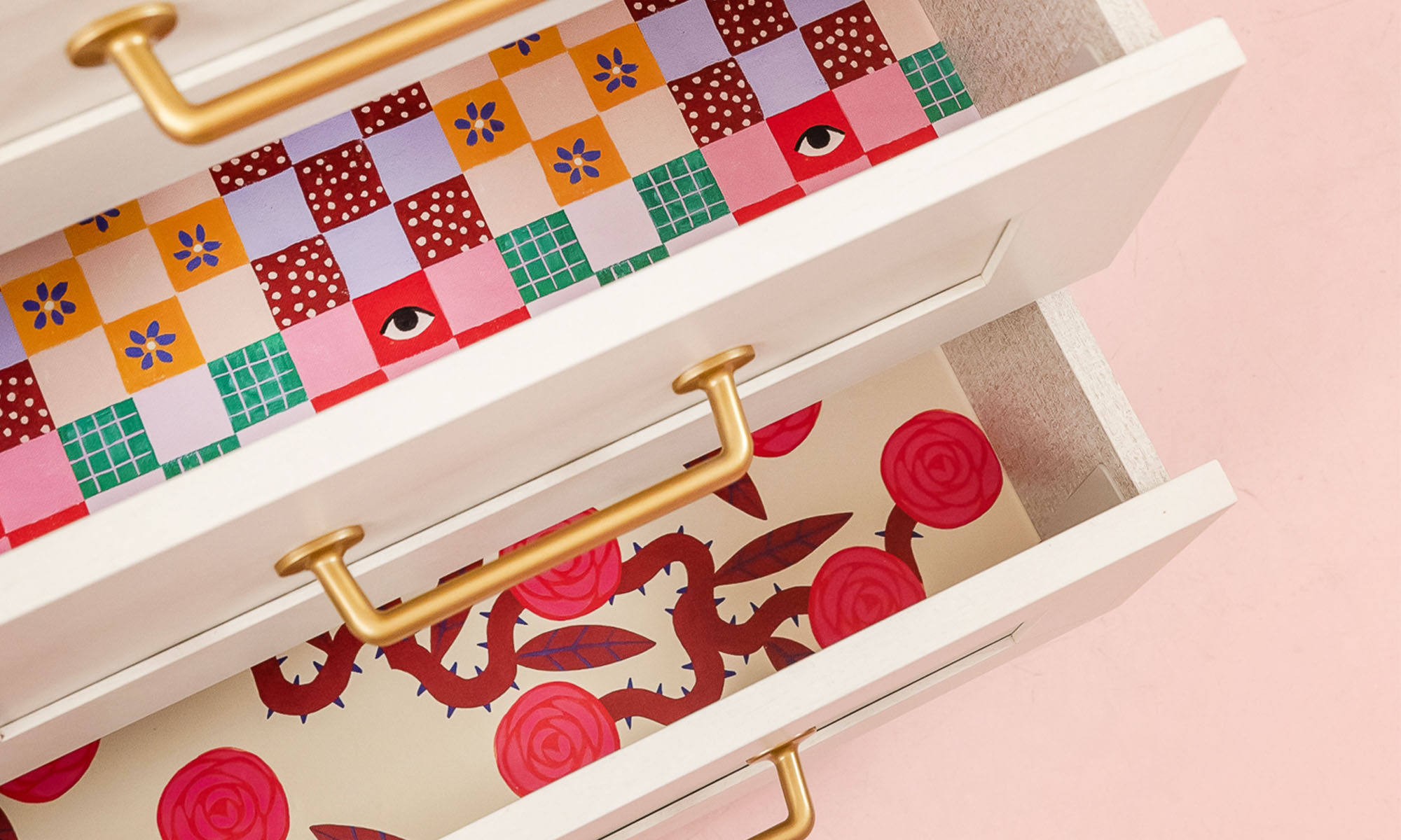 A close up view of Brittany's dresser liners using peel and stick wallpaper.