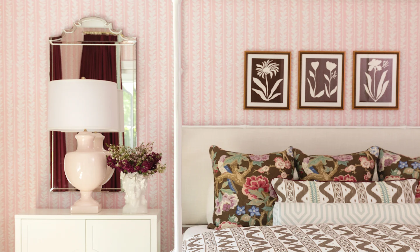 Bedroom with pink floral stripe wallpaper.