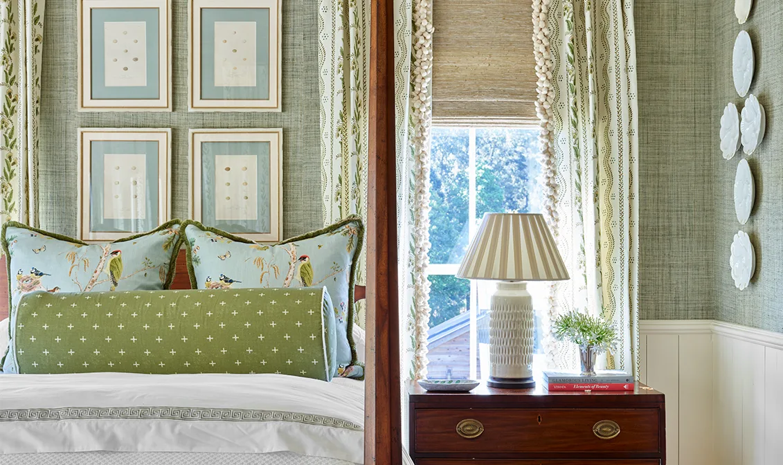Bedroom with textured green wallpaper and striped floral curtains.