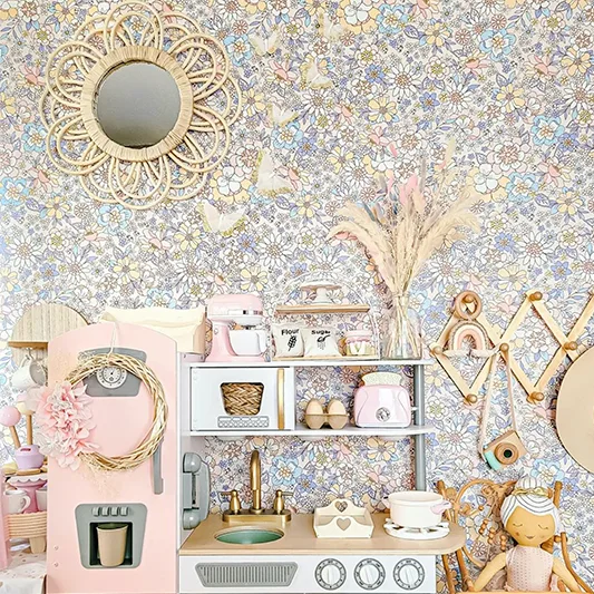 Floral Wallpaper behind a kids play kitchen.