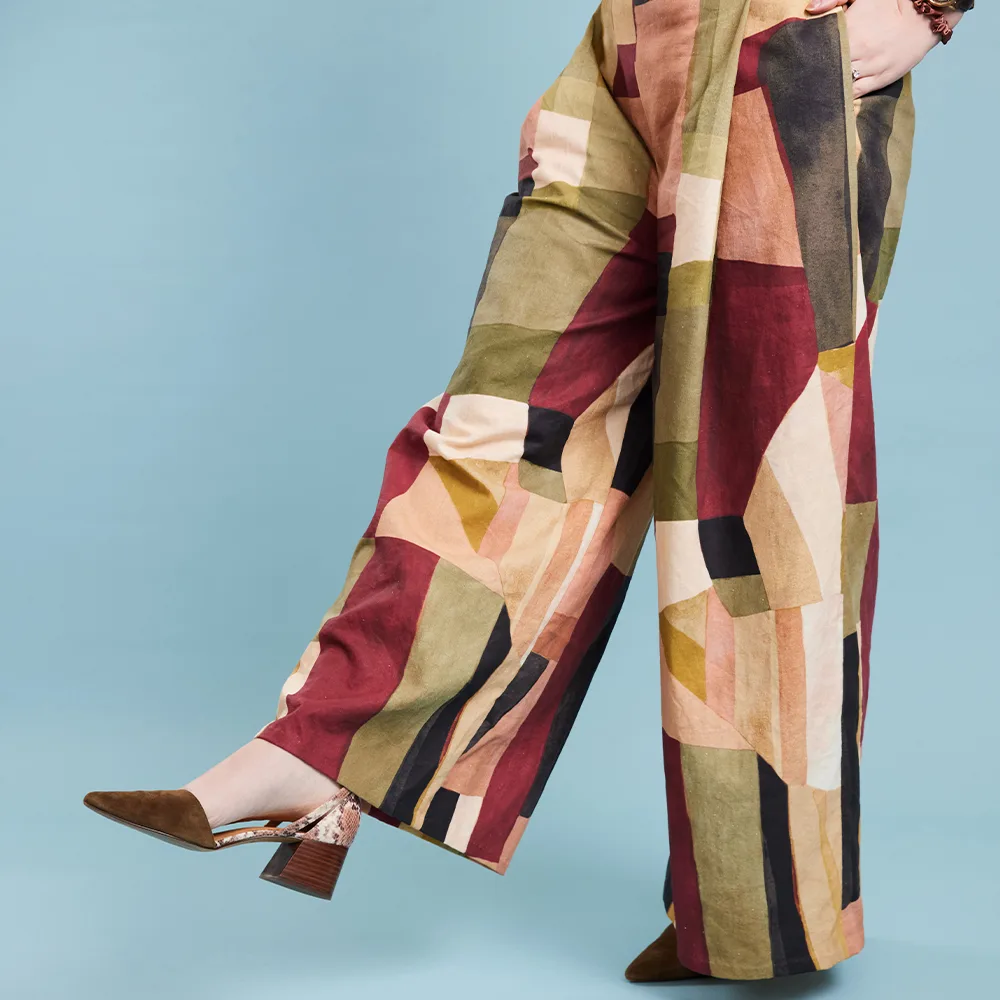 A model wearing pants made with Essex Linen
