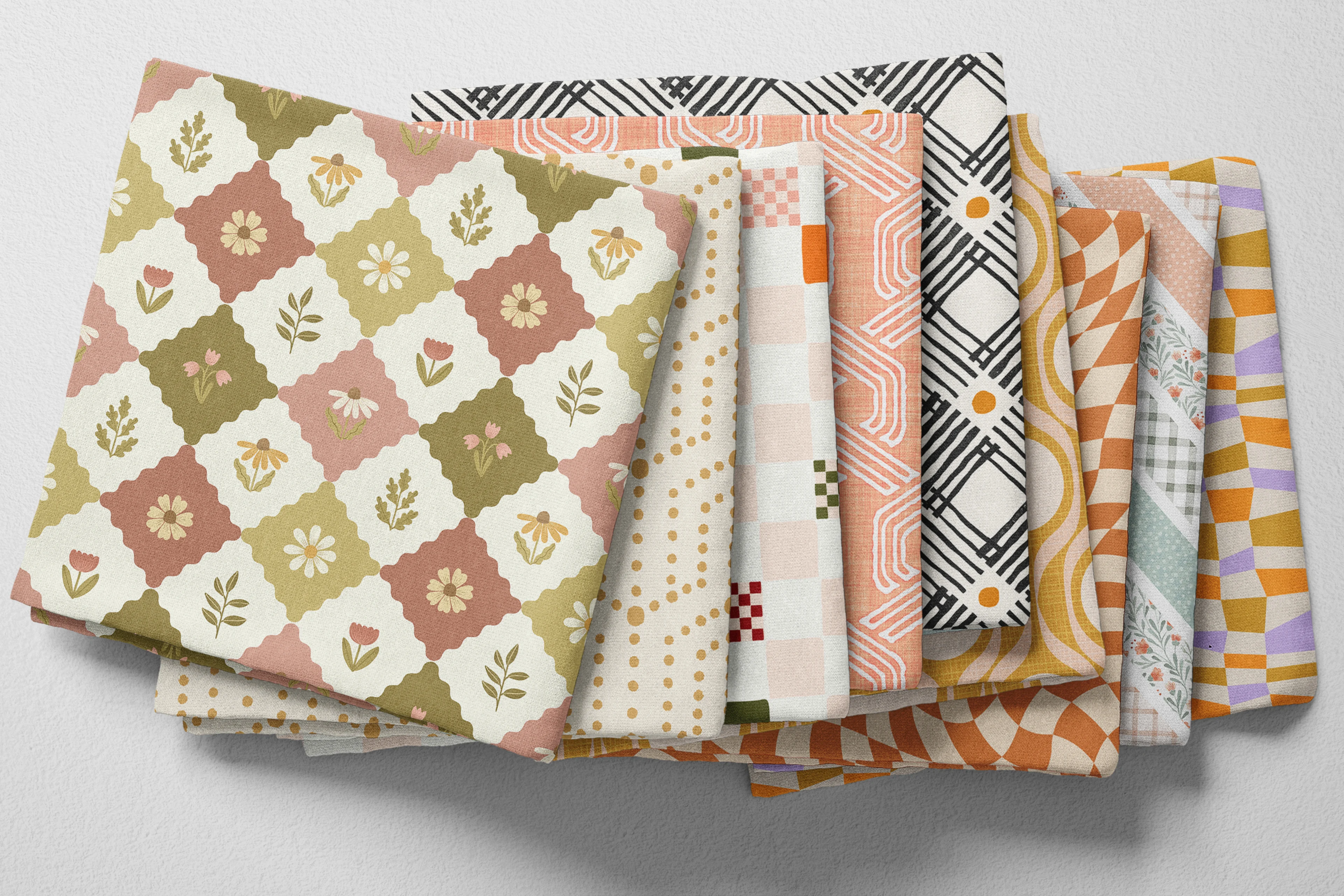 Colorful folded Spoonflower fabric with whimsical geometric prints